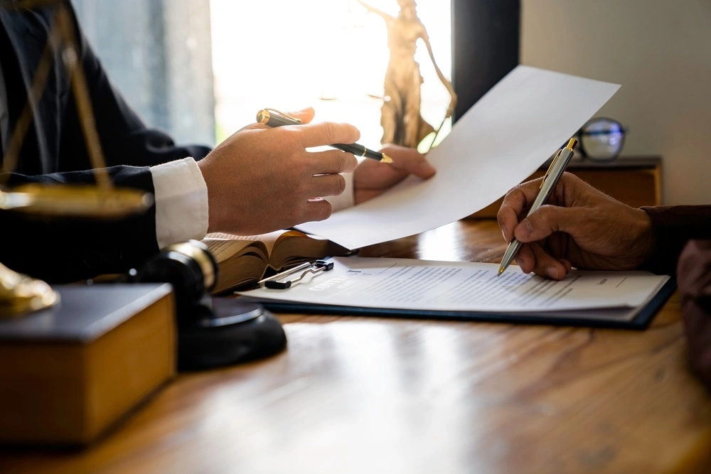 Los Angeles statutory rape lawyer consulting with a client, illustrating potential legal defenses against a California Penal Code § 261.5 charge.