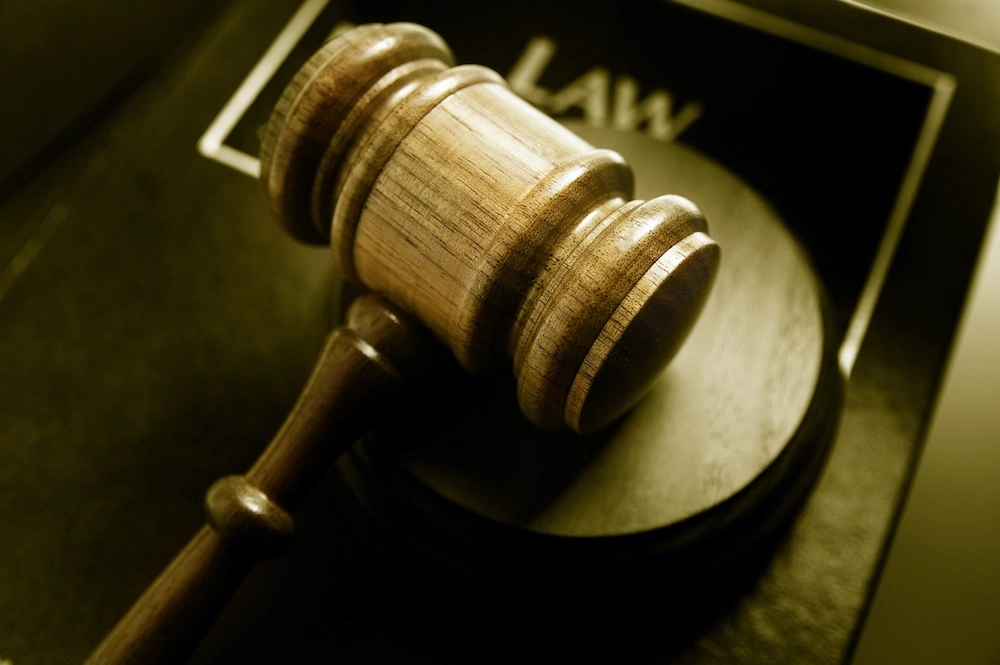 Law book and gavel displayed together, illustrating how grand theft differs from other theft charges under California law.