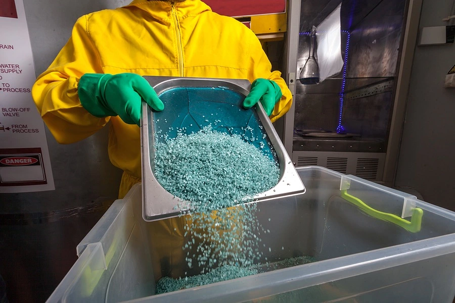 Methamphetamine manufacturing setup with chemical equipment and materials, illustrating the serious legal consequences of a drug manufacturing conviction in California.